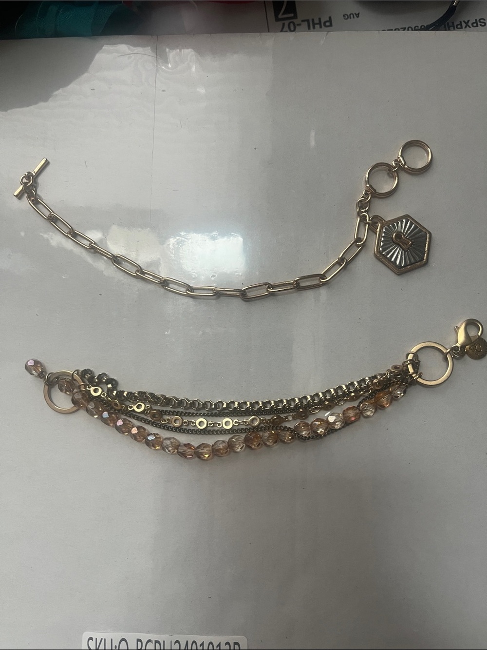 NWOT: Gold Tone Layered Charm Bracelet and Gold Chain Link with Keyhole Pendant